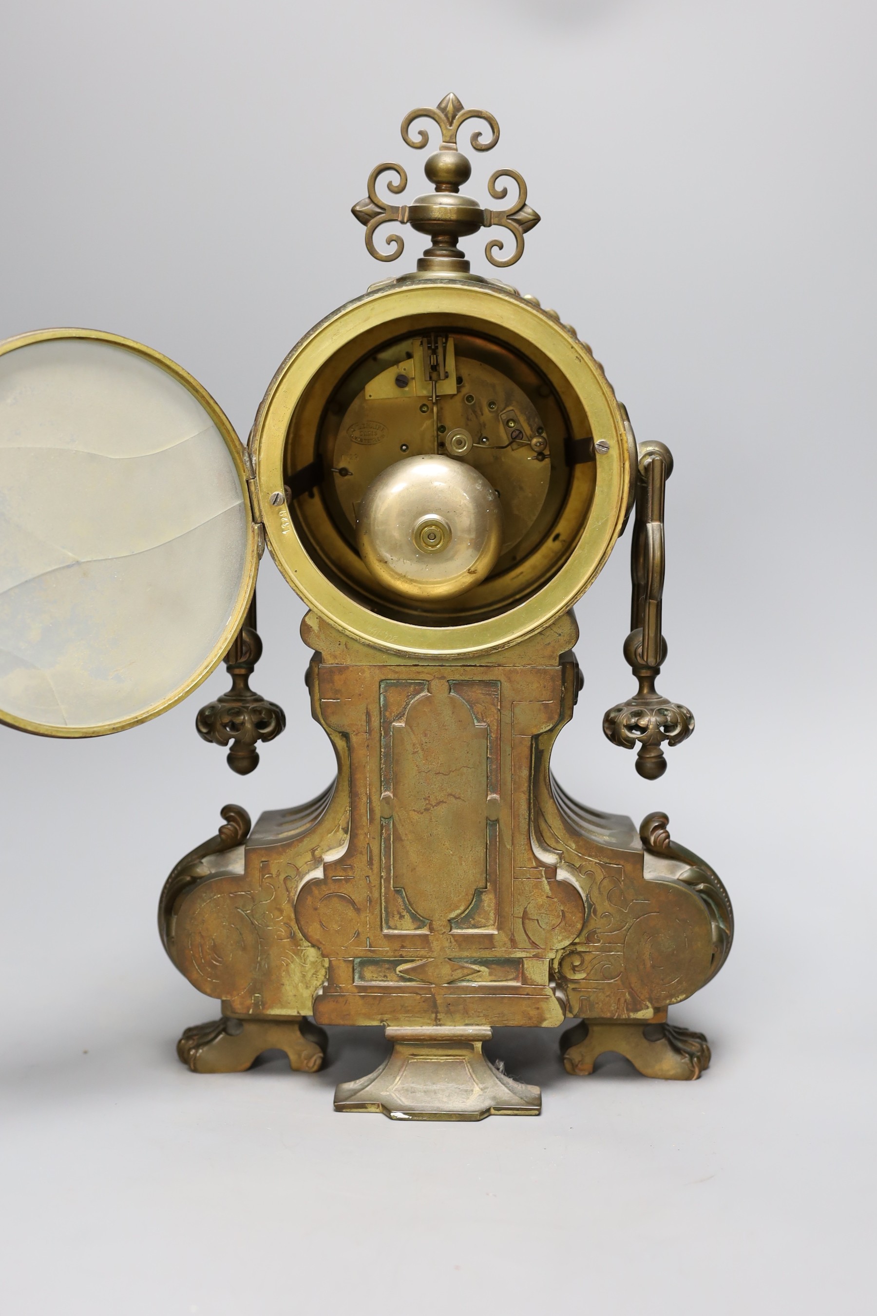 A late 19th century French brass cased mantel clock, 41 cms high